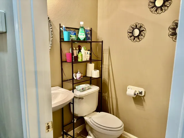 a view of a hallway with seating area