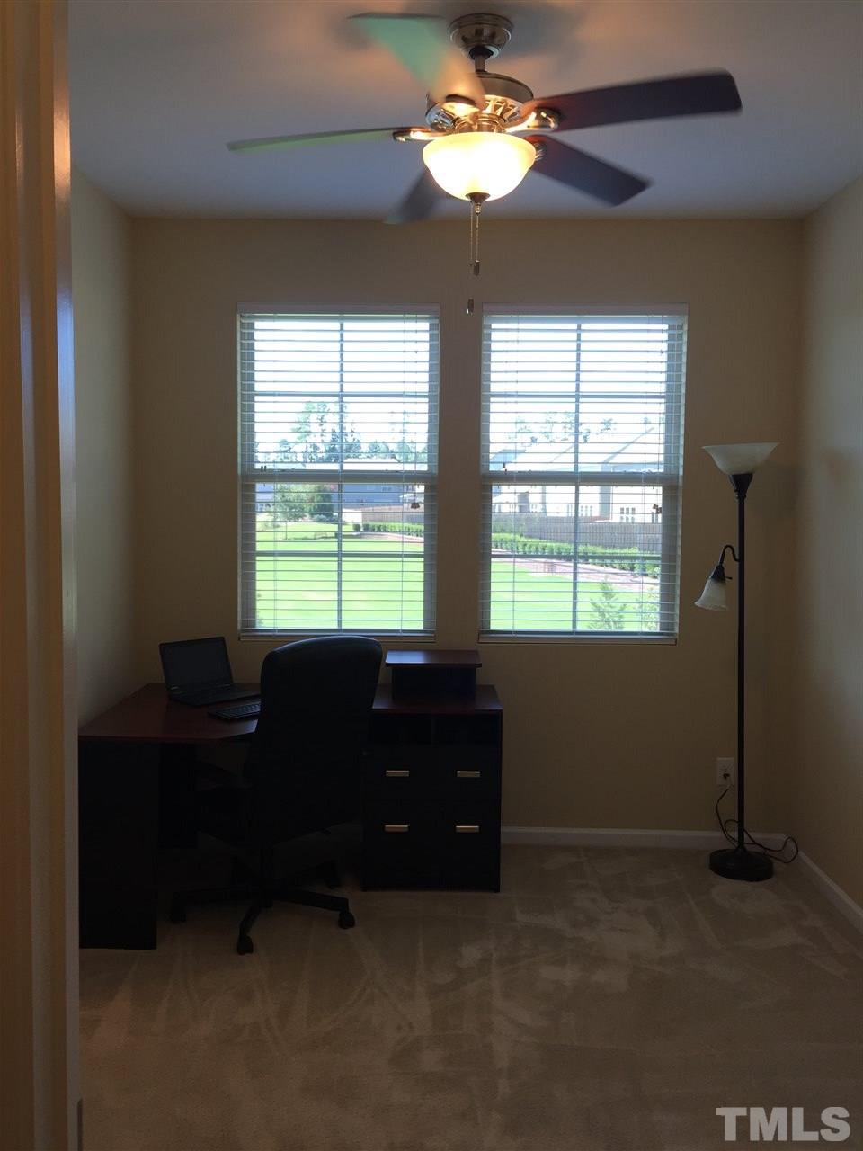 721 Wickham Ridge Road Apex, NC 27539 - Photo 15 of 25 a living room with furniture and a window