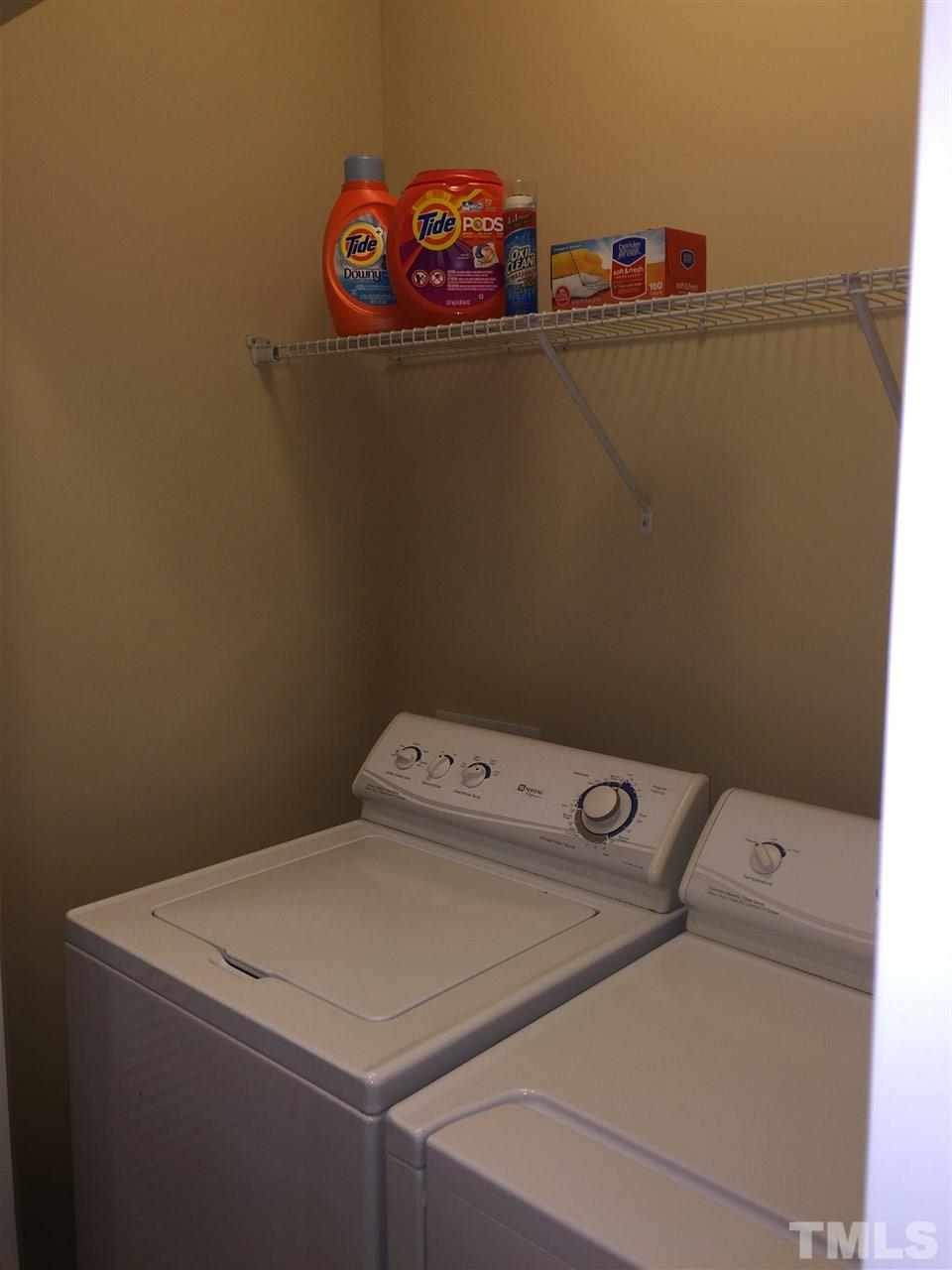 721 Wickham Ridge Road Apex, NC 27539 - Photo 18 of 25 a utility room with dryer and washer
