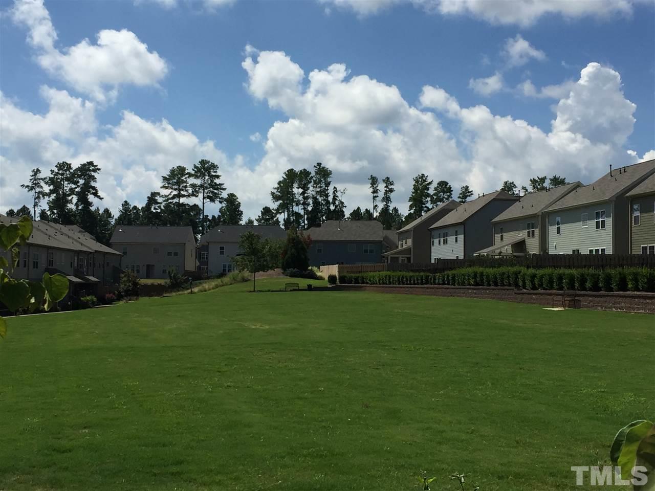 721 Wickham Ridge Road Apex, NC 27539 - Photo 20 of 25 a front view of a house with garden