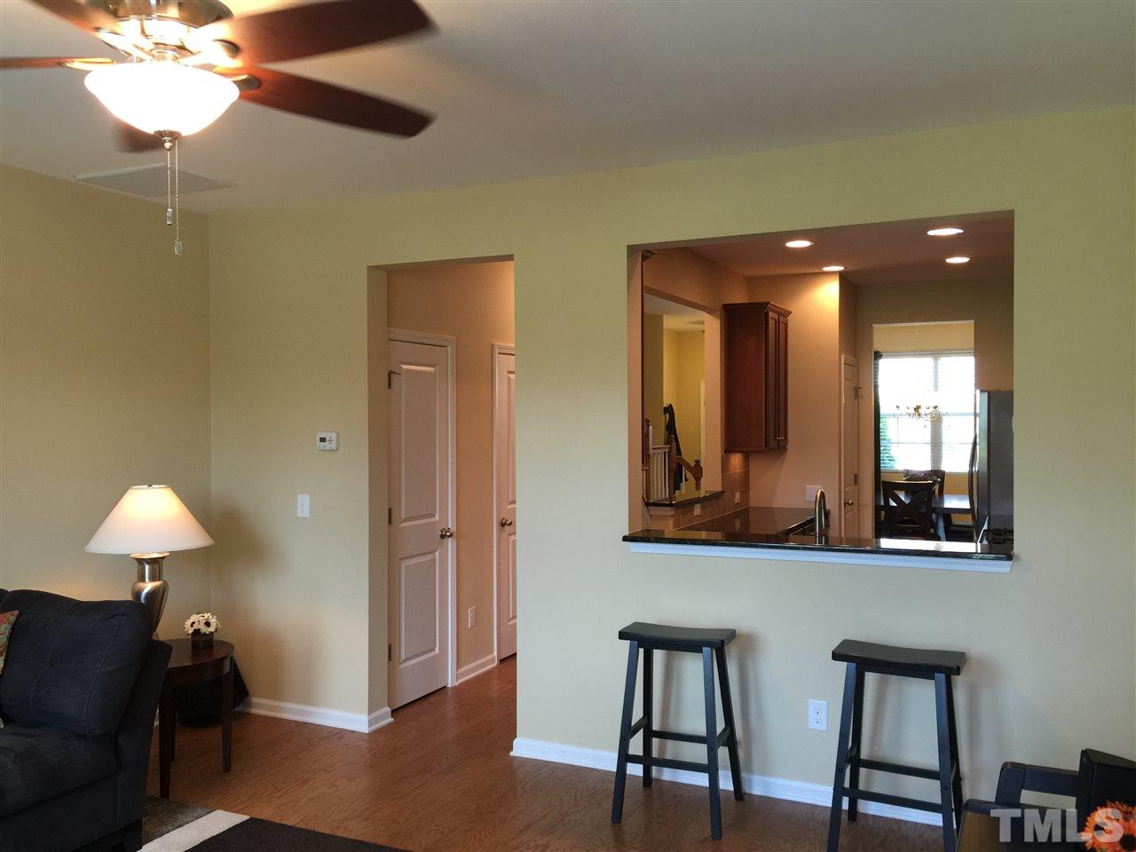 721 Wickham Ridge Road Apex, NC 27539 - Photo 10 of 25 a view of a bathroom with a mirror and a fan