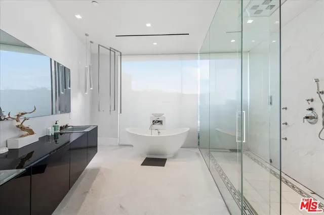 a kitchen that has a sink and a stove in it