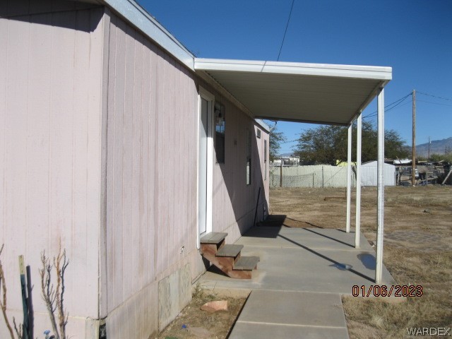 3454 Mayer Road Golden Valley, AZ 86413 - Photo 5 of 36 a patio with table and chairs