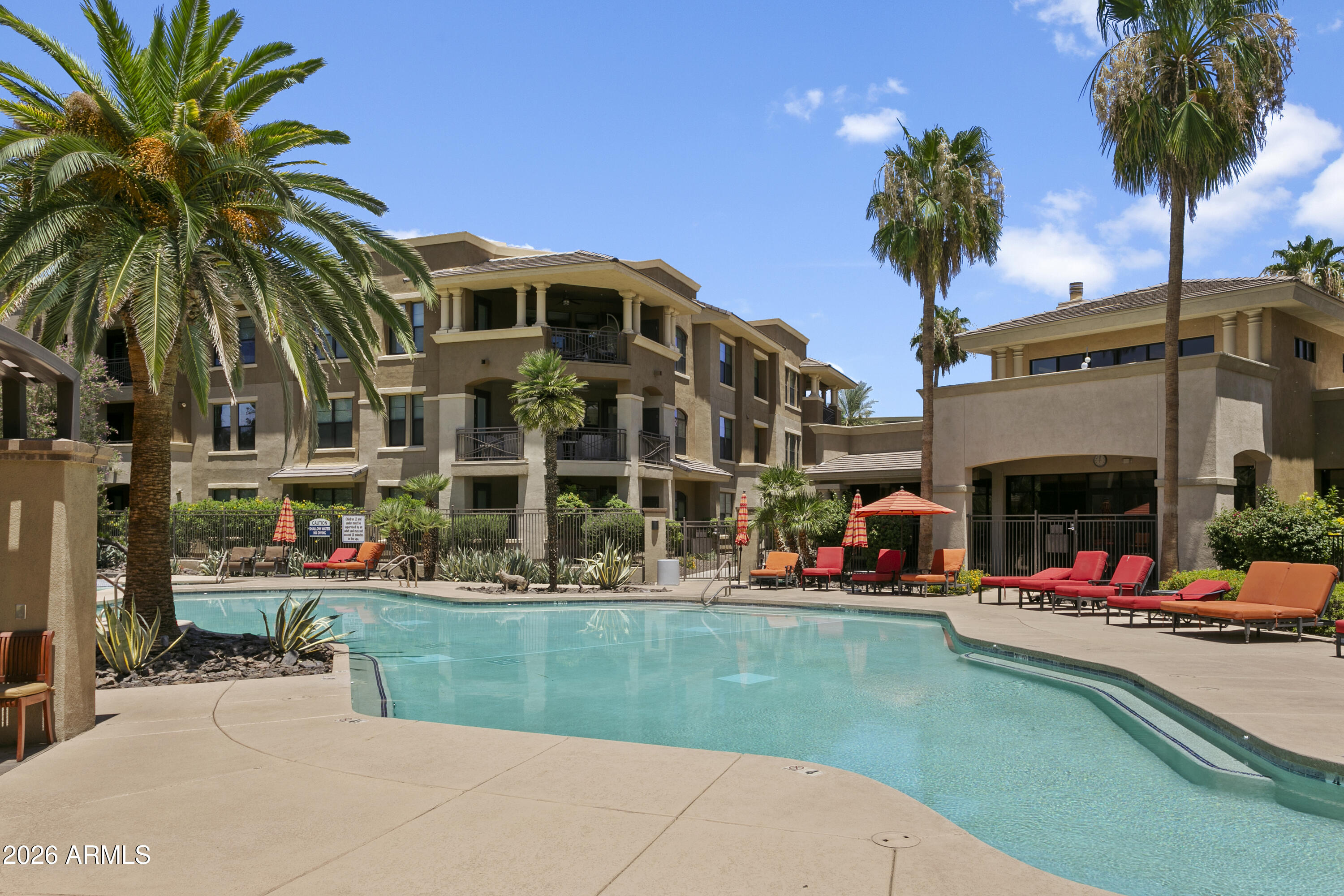 7601 East Indian Bend Road, Unit 1017 Scottsdale, AZ 85250 - Photo 27 of 49 a view of building and yard with large trees