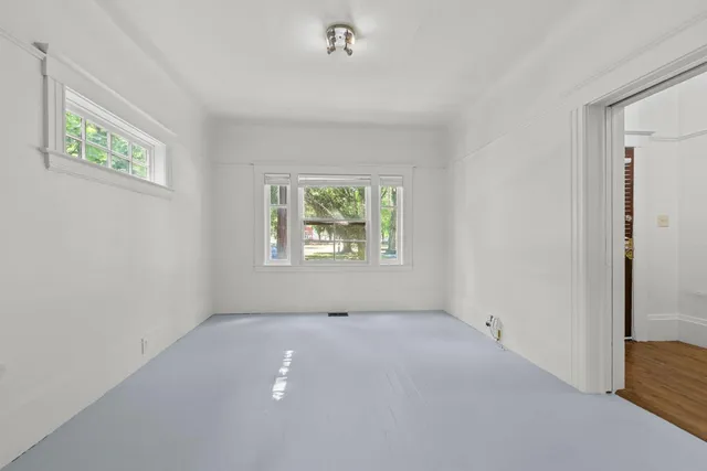 an empty room with windows