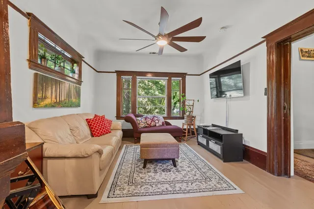 a living room with furniture rug and window
