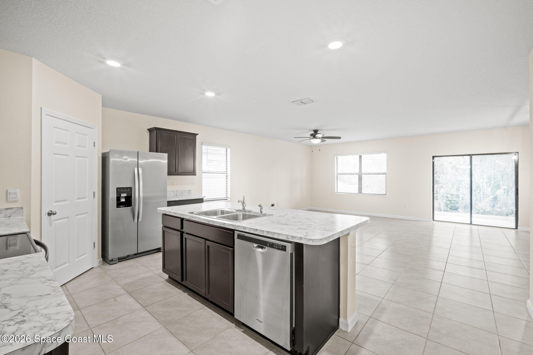 4412 Talbot Boulevard Cocoa, FL 32926 - Photo 13 of 32 a kitchen with a sink stove and refrigerator