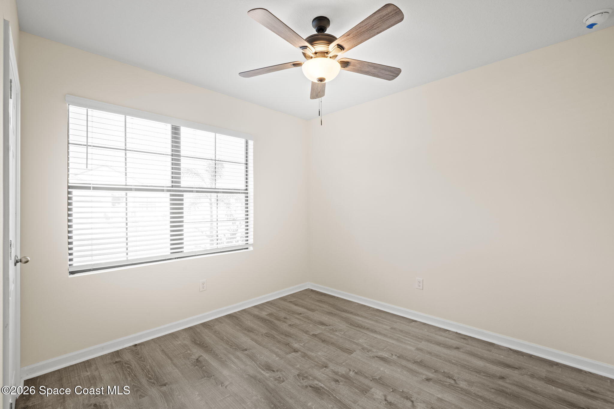 4412 Talbot Boulevard Cocoa, FL 32926 - Photo 19 of 32 an empty room with a window and a fan