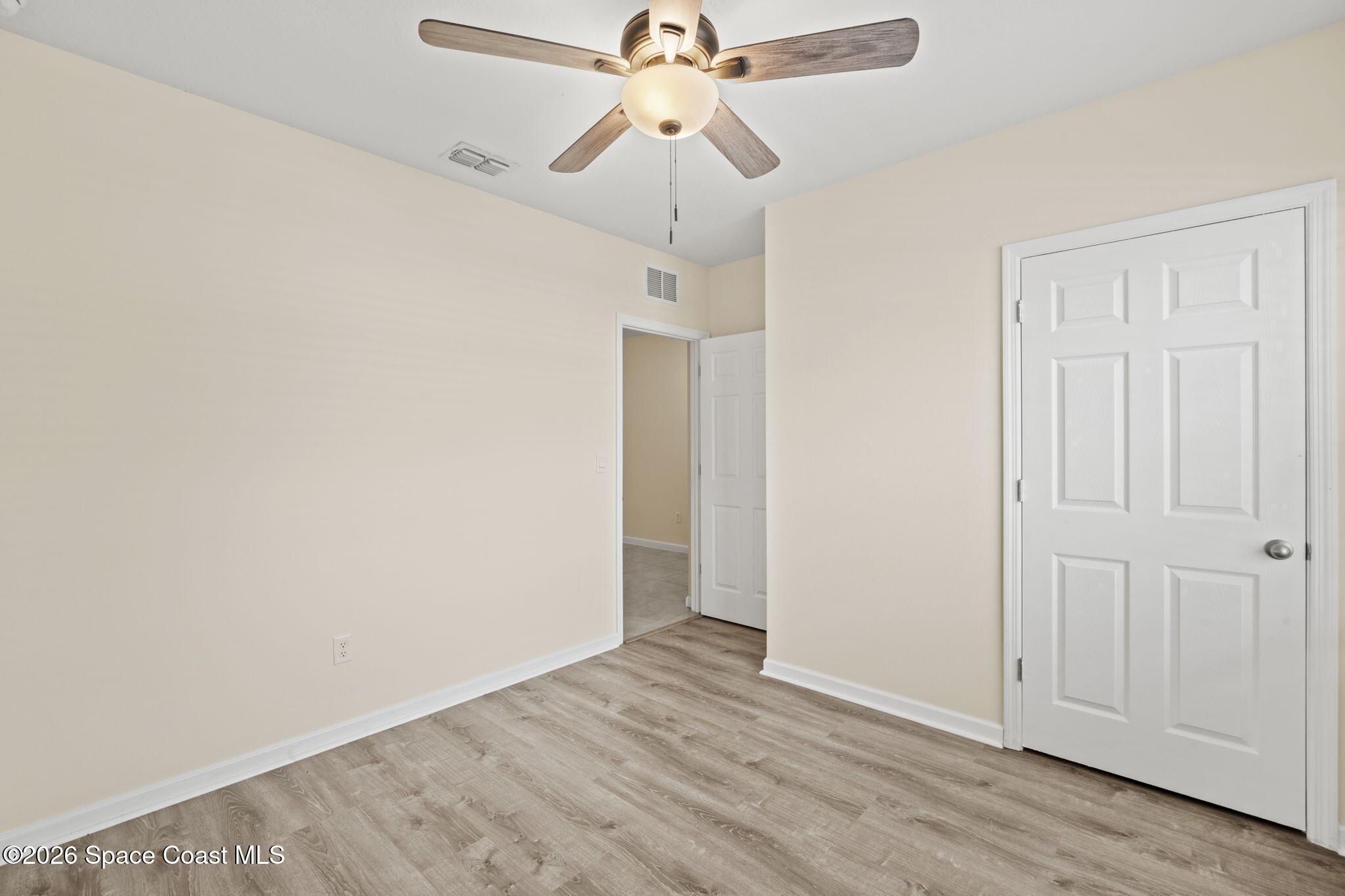 4412 Talbot Boulevard Cocoa, FL 32926 - Photo 20 of 32 a view of a chandelier fan and hardwood floor
