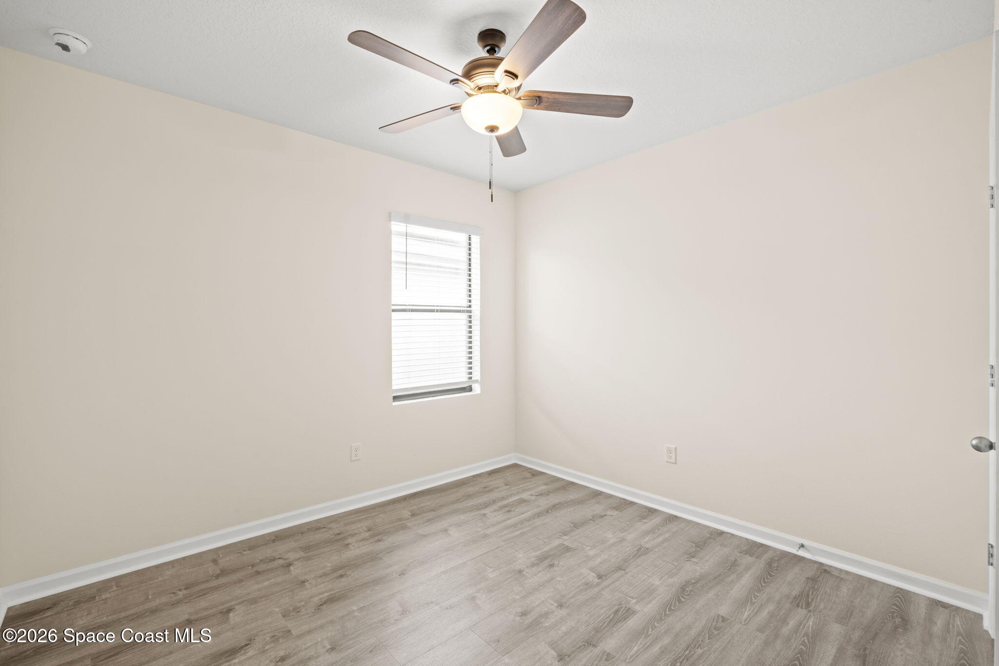 4412 Talbot Boulevard Cocoa, FL 32926 - Photo 21 of 32 an empty room with a window and a fan
