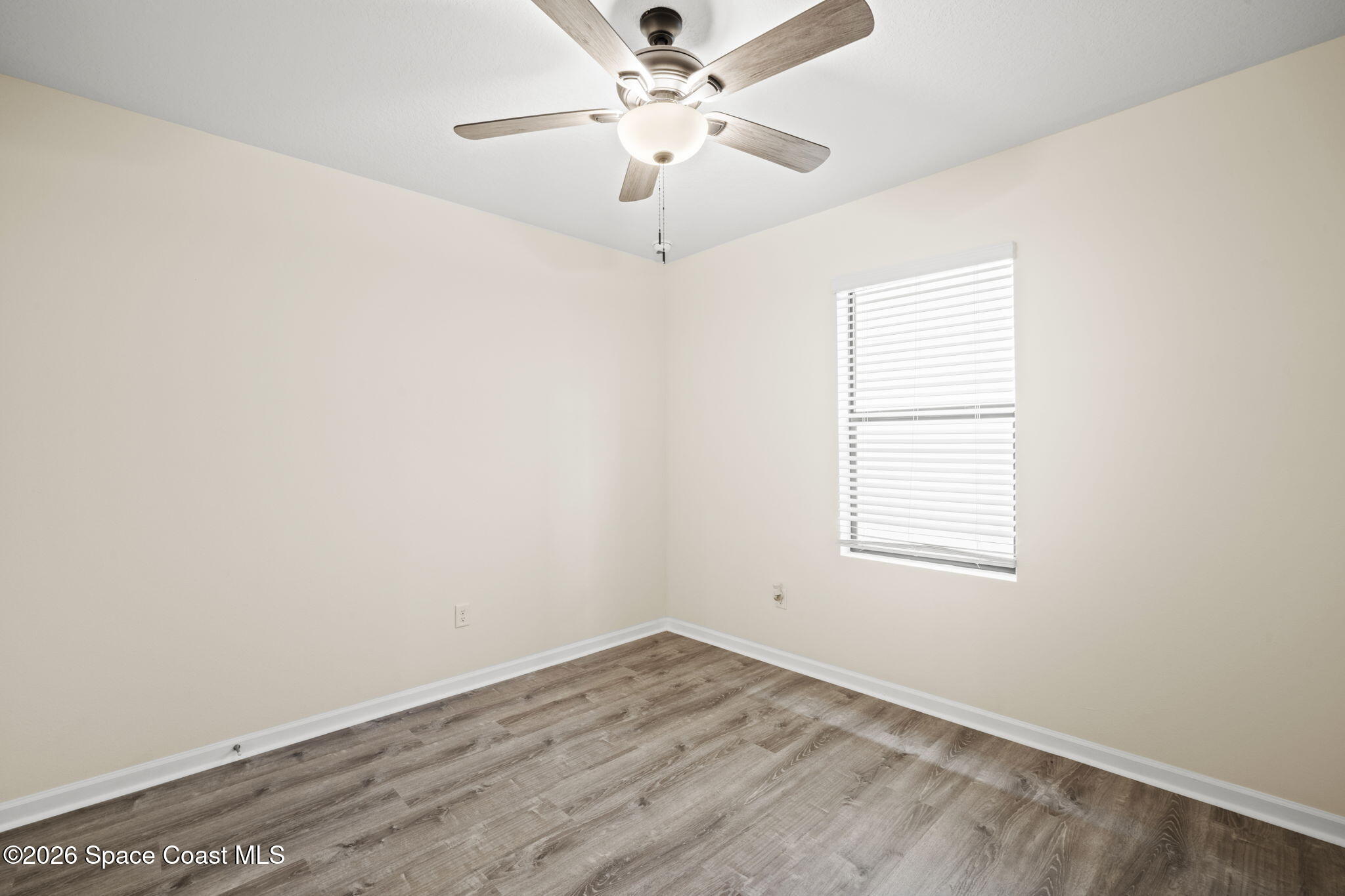 4412 Talbot Boulevard Cocoa, FL 32926 - Photo 23 of 32 an empty room with a window and a ceiling fan