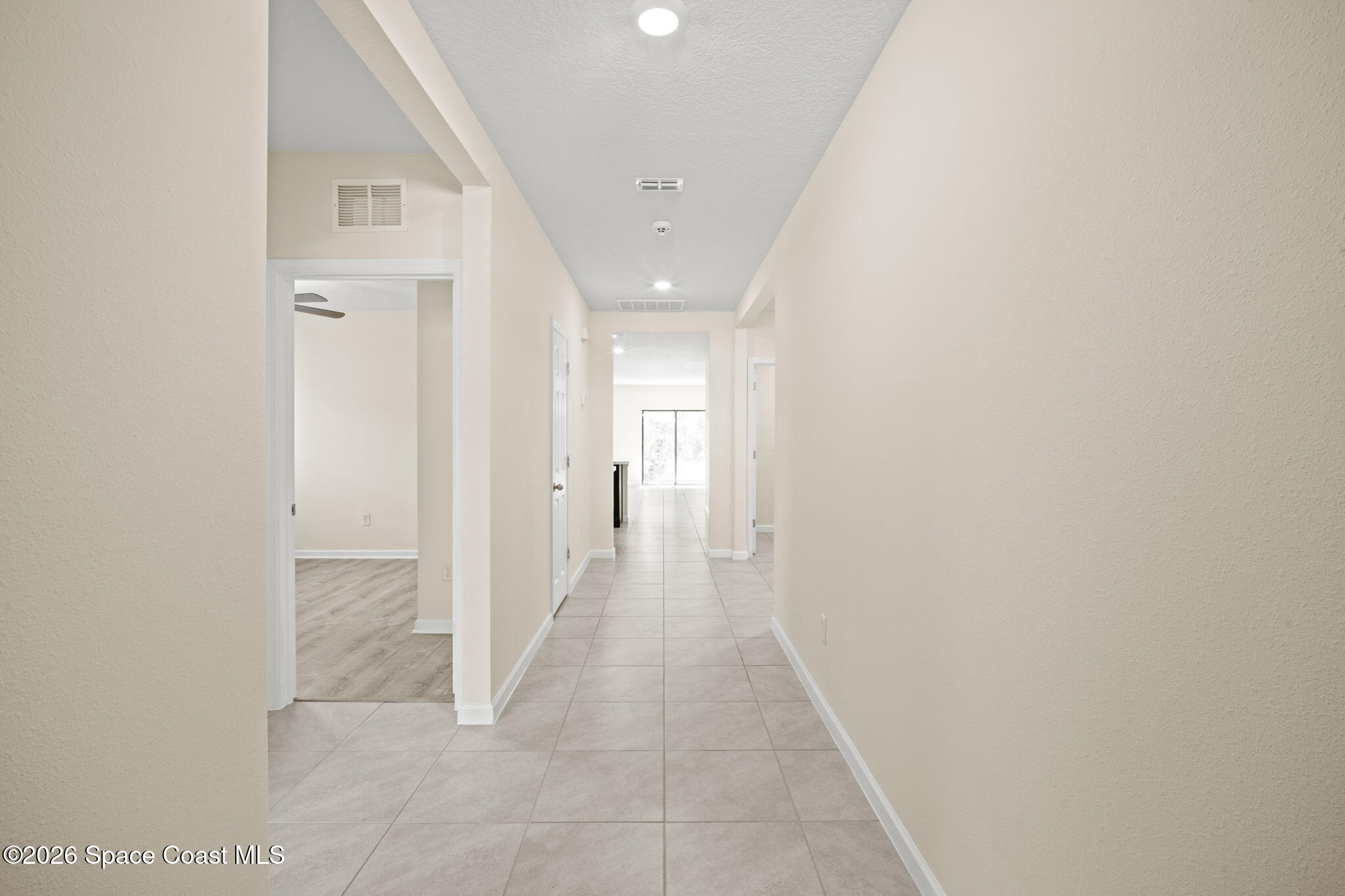 4412 Talbot Boulevard Cocoa, FL 32926 - Photo 7 of 32 a view of a hallway with wooden shelves