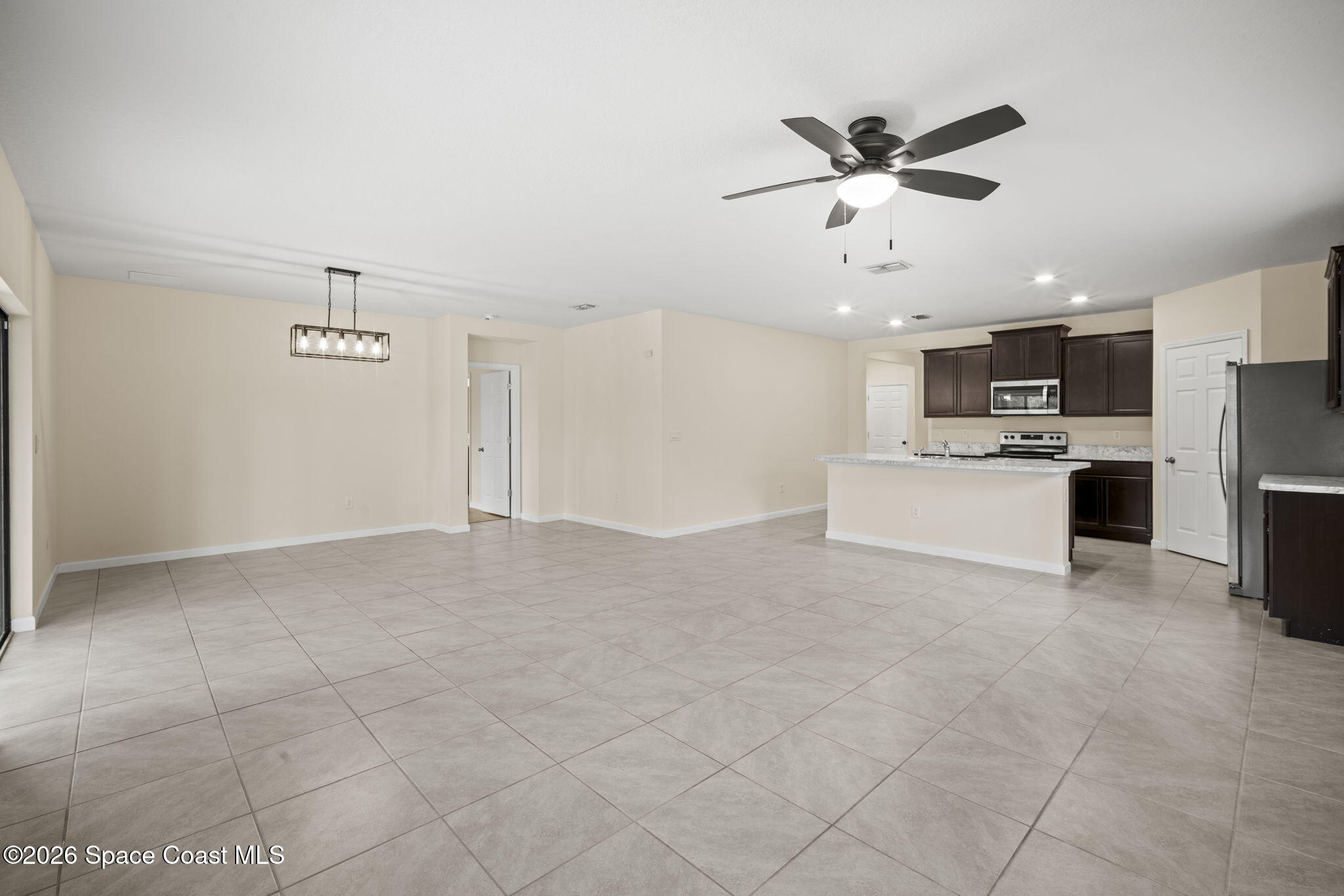 4412 Talbot Boulevard Cocoa, FL 32926 - Photo 10 of 32 a view of a livingroom with furniture and a ceiling fan
