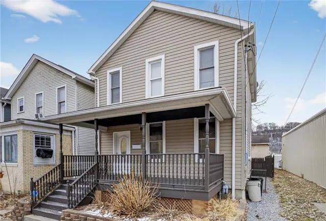 a front view of a house with a porch
