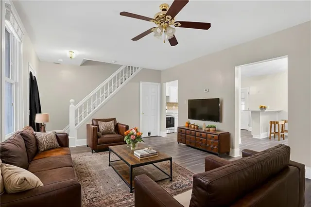 a living room with furniture and a flat screen tv