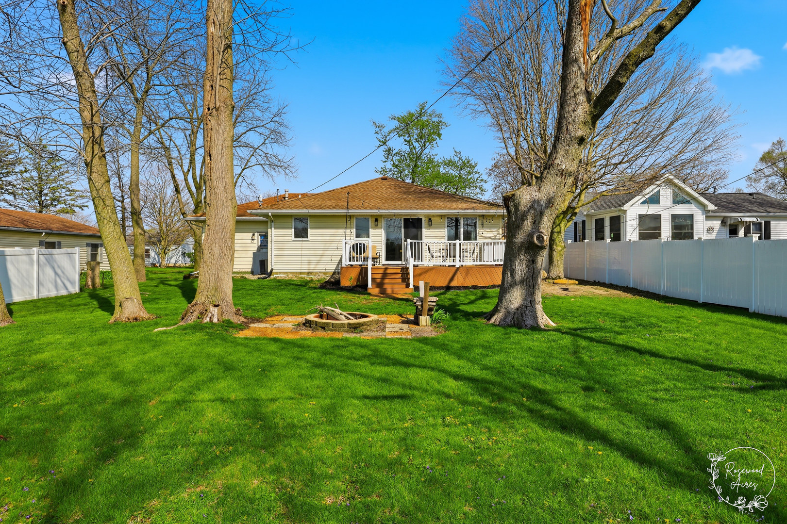 175 North Elm Street Herscher, IL 60941 - Photo 19 of 22 a view of a house with a yard deck and a large tree