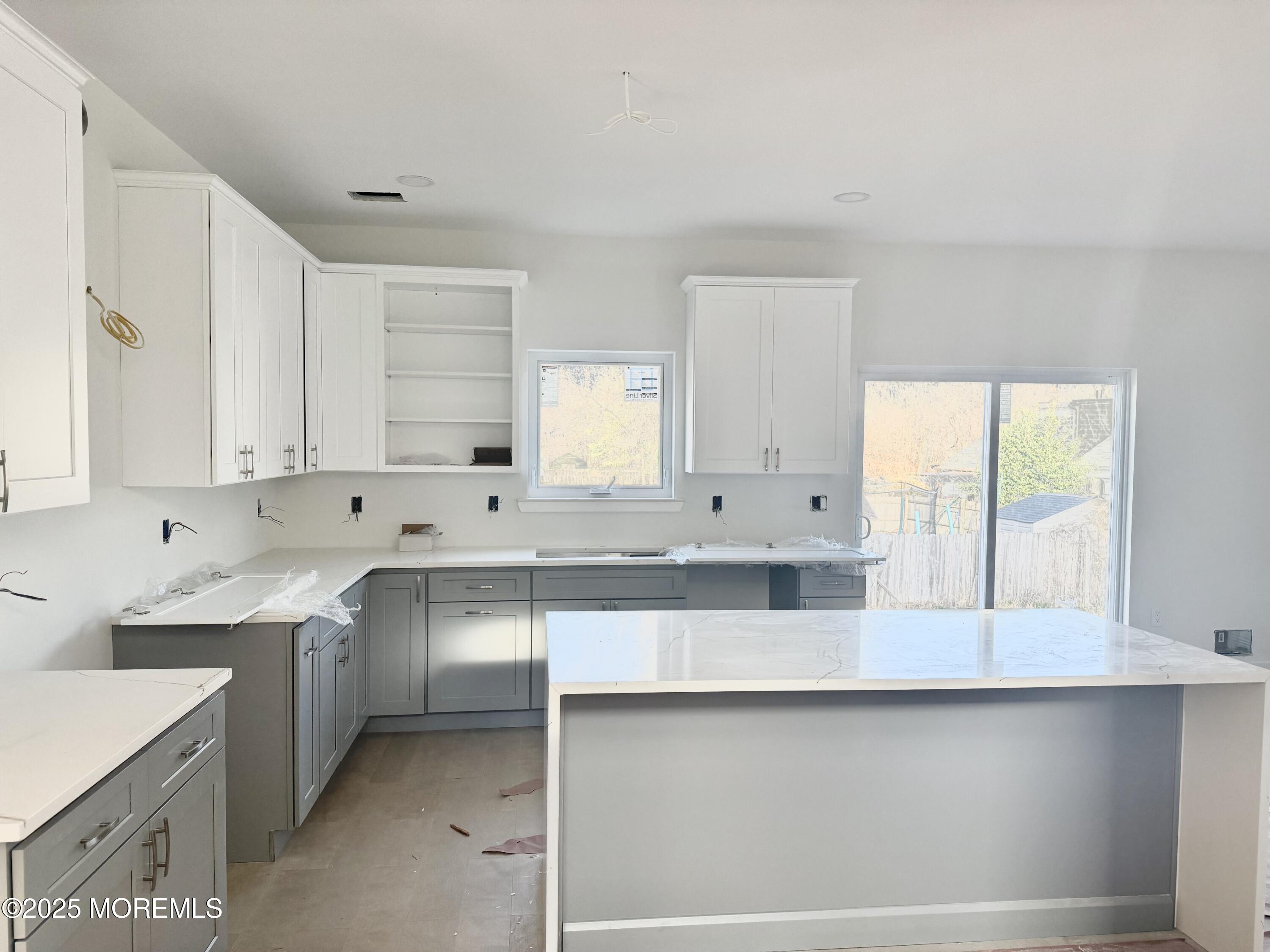 68 Main Street Manalapan, NJ 07726 - Photo 12 of 24 a kitchen with counter top space sink and cabinets