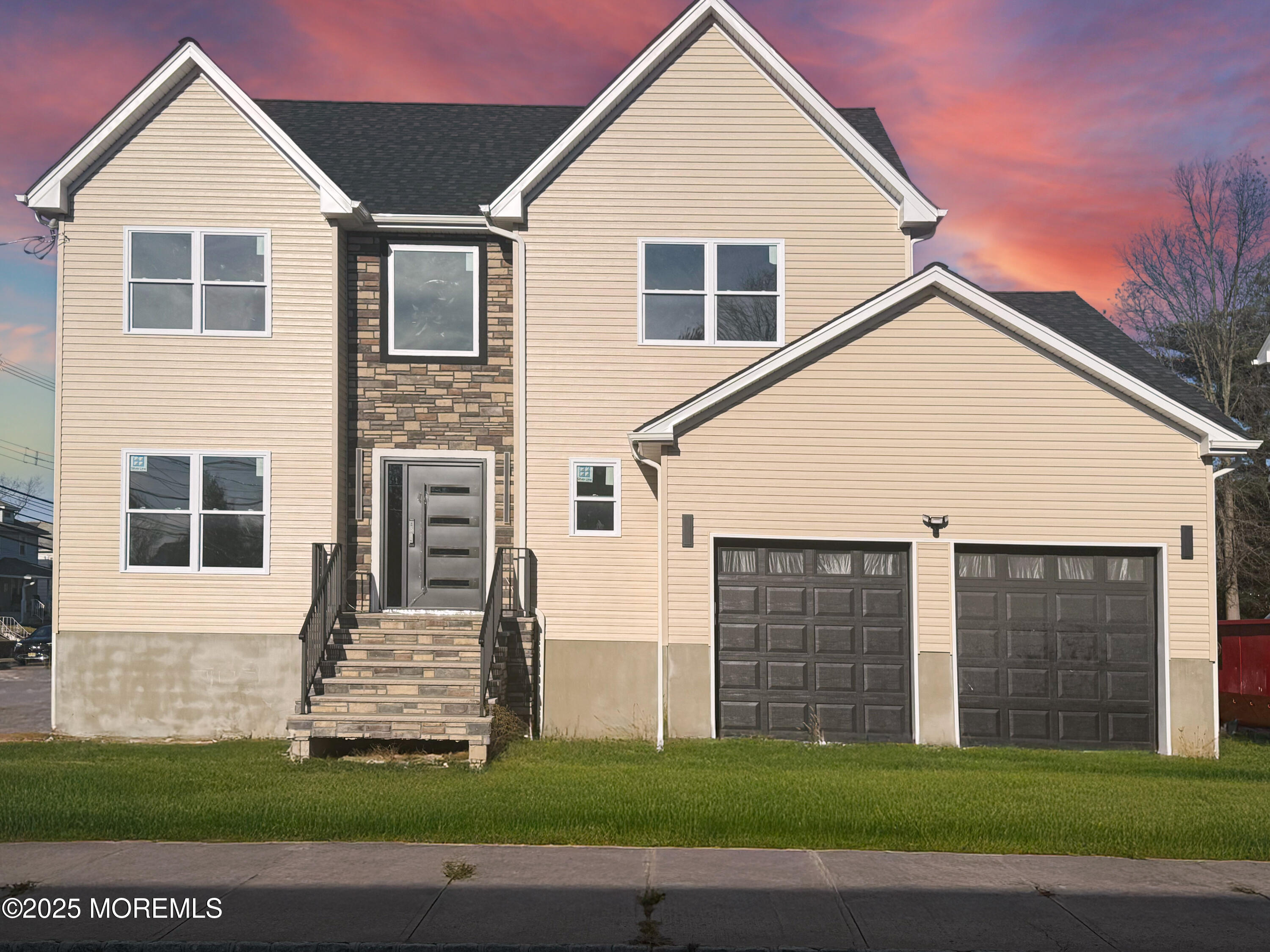 68 Main Street Manalapan, NJ 07726 - Photo 2 of 24 a front view of a house with a yard