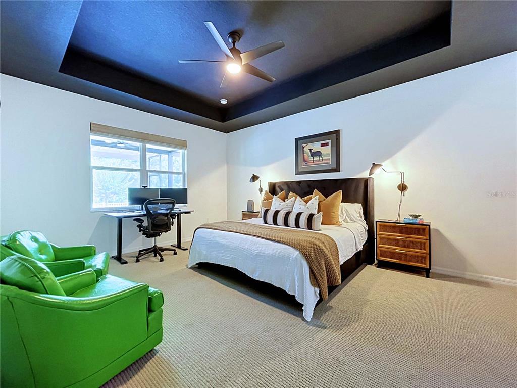 18078 Romanesque Court Spring Hill, FL 34610 - Photo 31 of 81 a bed room with a bed and a couch