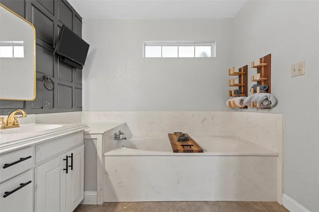 a utility room with a sink dryer and washer
