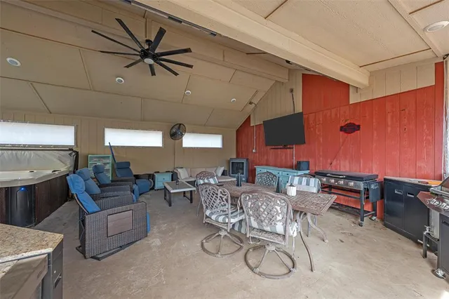 a living room with furniture a air conditioner vent and a window