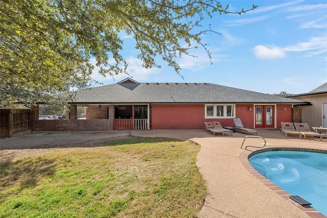 a front view of a house with yard patio and fire pit