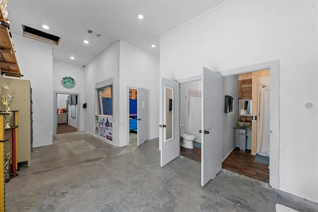 a view of a livingroom with a walk in closet and bedroom