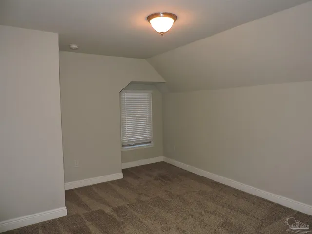 an empty room with closet area