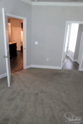 a view of a livingroom with wooden floor and a window