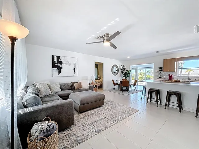 a living room with furniture and a table