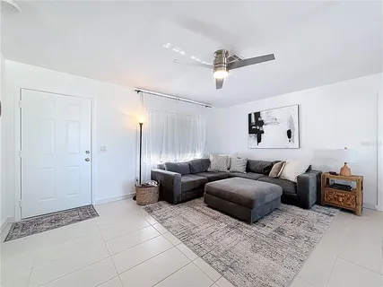a living room with furniture and a window