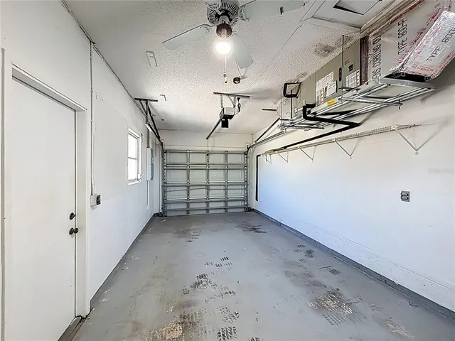 a view of a house with swimming pool and sitting area