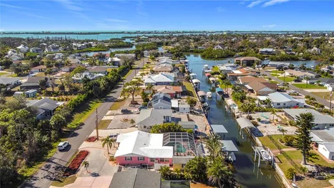 an aerial view of residential building and ocean