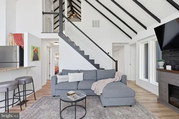 a living room with furniture and a rug