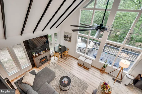 a view of living room with furniture and a window