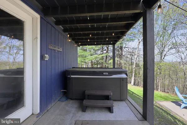 a view of patio with a table and chairs