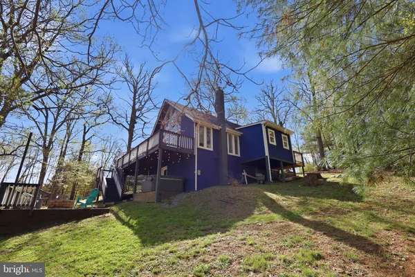 a view of a house with pool porch and sitting area