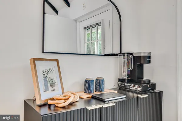 a kitchen with a sink a stove and cabinets