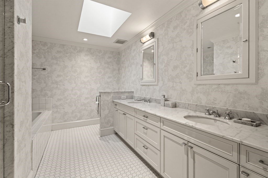 84 Old Colony Road Wellesley, MA 02481 - Photo 20 of 39 a spacious bathroom with a granite countertop sink a toilet mirror and shower