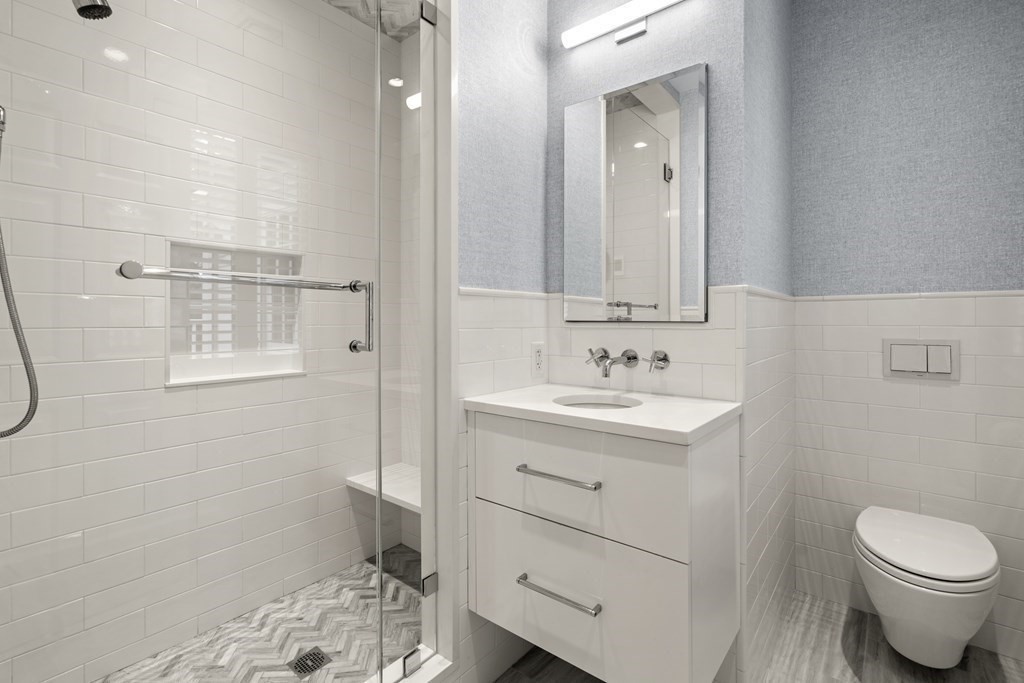 84 Old Colony Road Wellesley, MA 02481 - Photo 22 of 39 a bathroom with a sink a toilet and shower