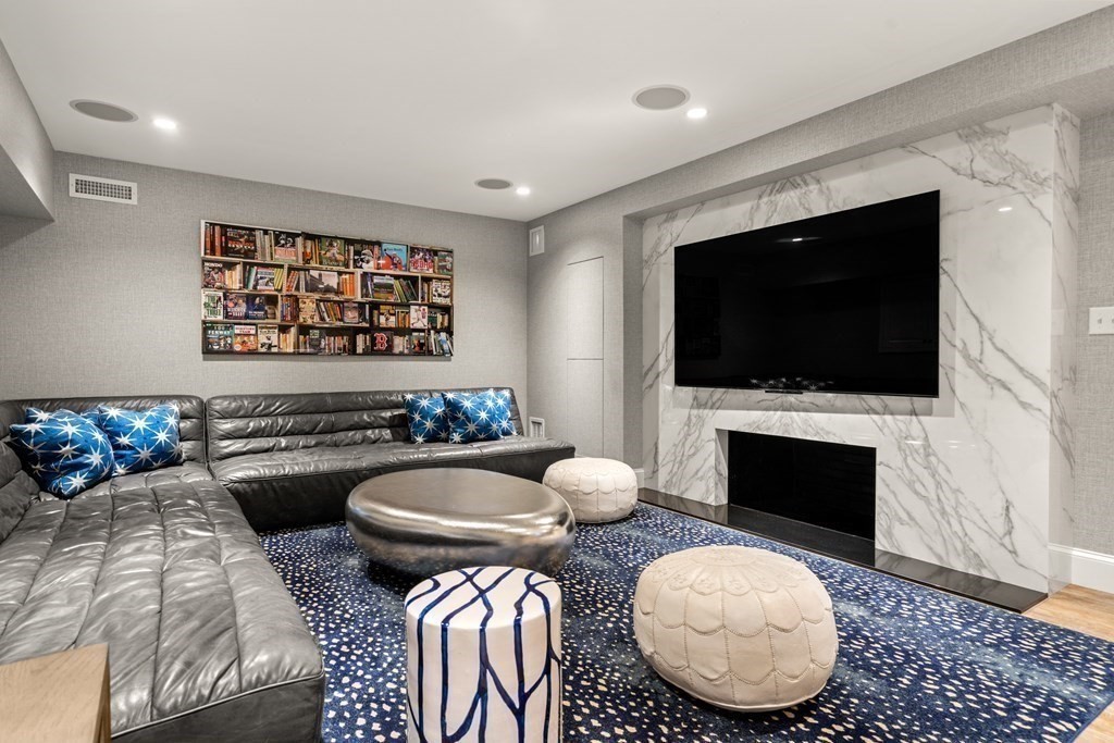 84 Old Colony Road Wellesley, MA 02481 - Photo 29 of 39 a living room with furniture a flat screen tv and a fireplace