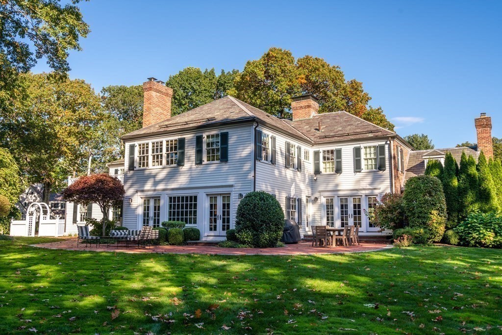 84 Old Colony Road Wellesley, MA 02481 - Photo 37 of 39 a front view of a house with swimming pool having outdoor seating
