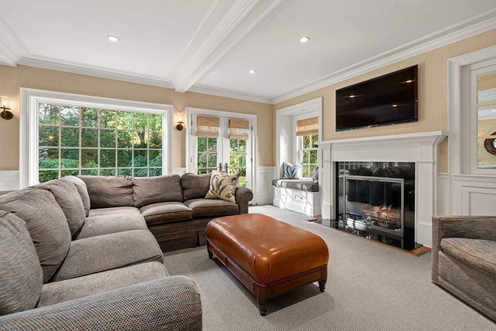 84 Old Colony Road Wellesley, MA 02481 - Photo 7 of 39 a living room with furniture flat screen tv and a fireplace