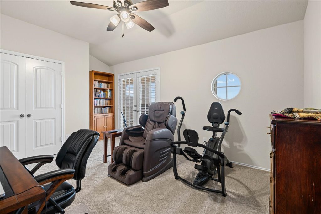 212 Plata Lane Jarrell, TX 76537 - Photo 14 of 29 Office space featuring lofted ceiling, light carpet, french doors, and ceiling fan