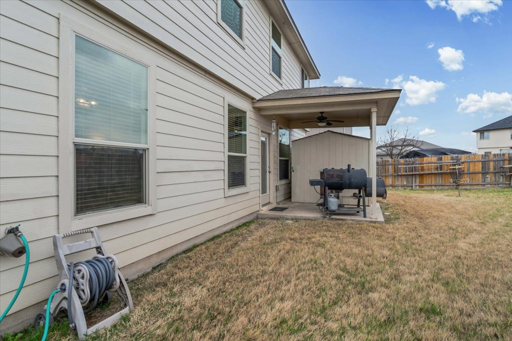 212 Plata Lane Jarrell, TX 76537 - Photo 24 of 29 Fenced yard featuring a patio and a ceiling fan
