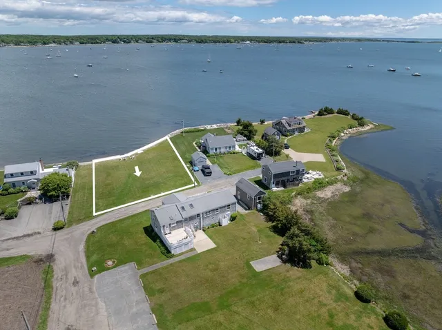 an aerial view of a house with a swimming pool