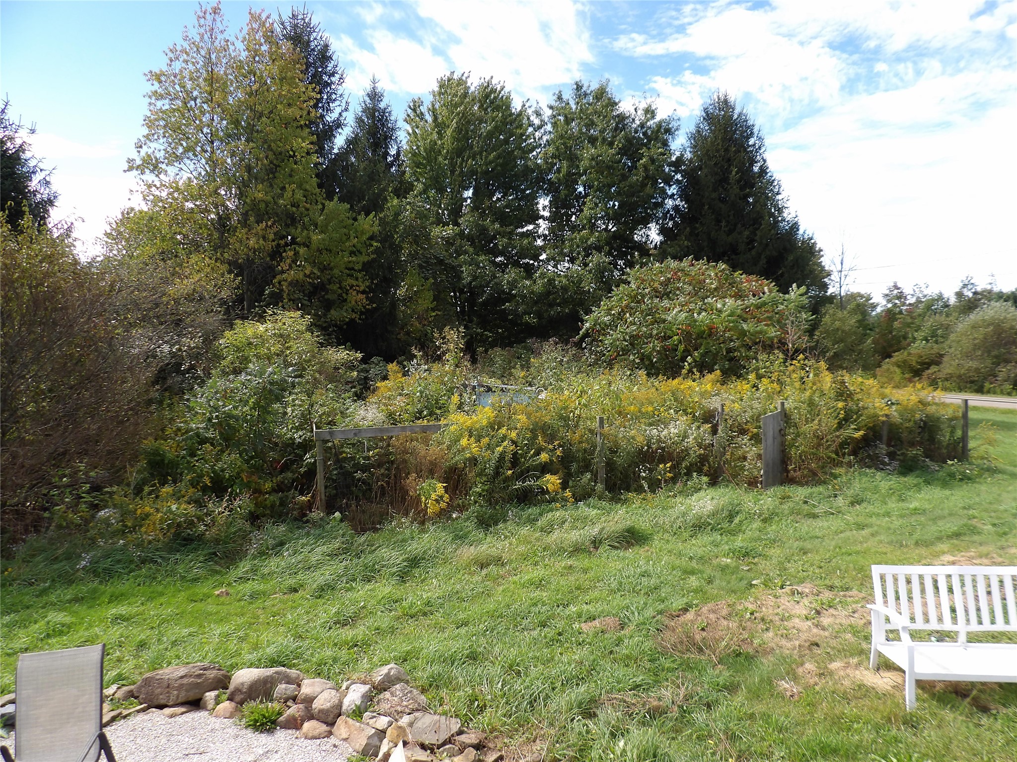 1345 Donation Road Erie, PA 16509 - Photo 39 of 47 Fenced in garden area - a bit overgrown but includes a chicken coop!
