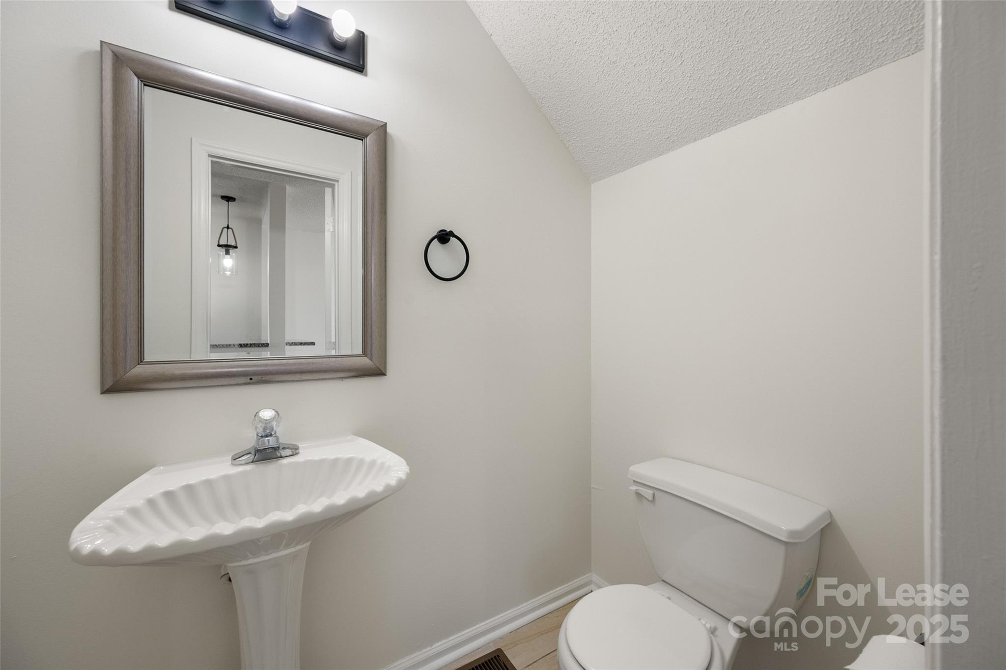 608 Bethpage Road Kannapolis, NC 28081 - Photo 18 of 37 a bathroom with a toilet sink and mirror