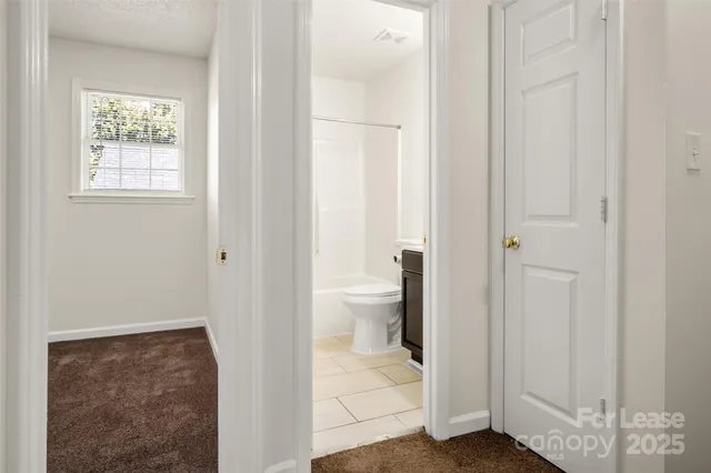 a view of bathroom with a toilet sink