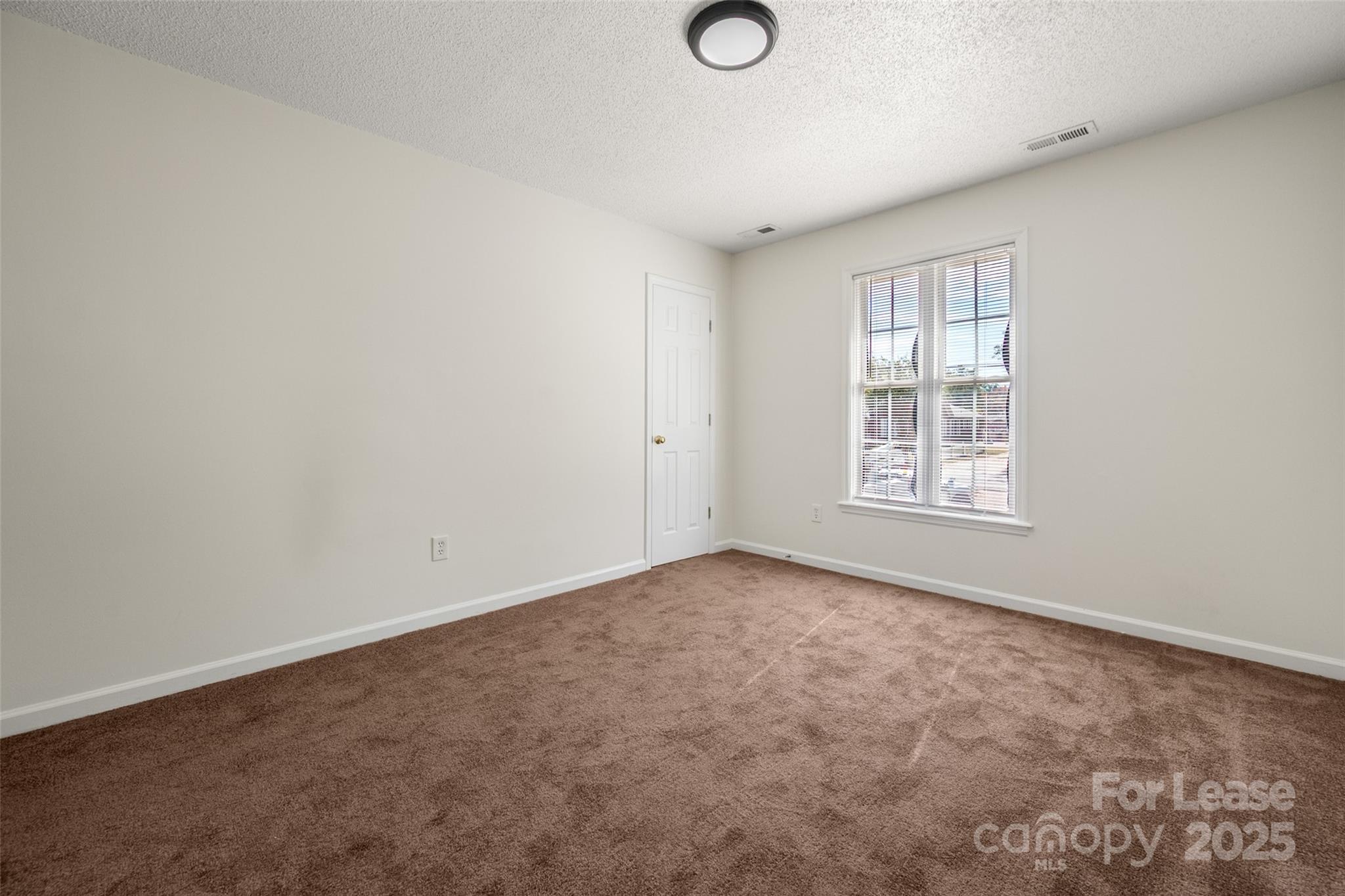 608 Bethpage Road Kannapolis, NC 28081 - Photo 23 of 37 an empty room with windows